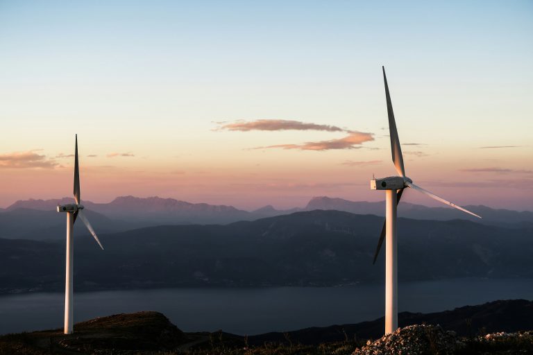 Wind turbines on mountain at dusk